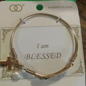 Beautiful gold bracelet ( blessed) with charms pearl and cross .. gold